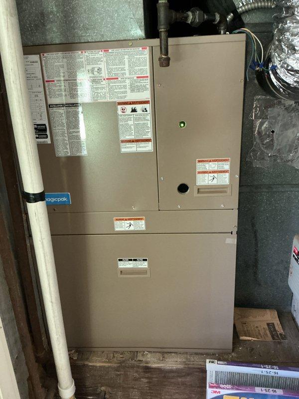 Completed comprehensive AC tune-up on residential split system with air handler located in attic space and outdoor condenser unit accessible via roof access. Performed full preventive maintenance protocol including filter inspection, electrical connections verification, refrigerant level assessment, condensate drain line check, and system operational testing. All components found operating within manufacturer specifications with green status indicator illuminated, confirming proper system function upon completion.