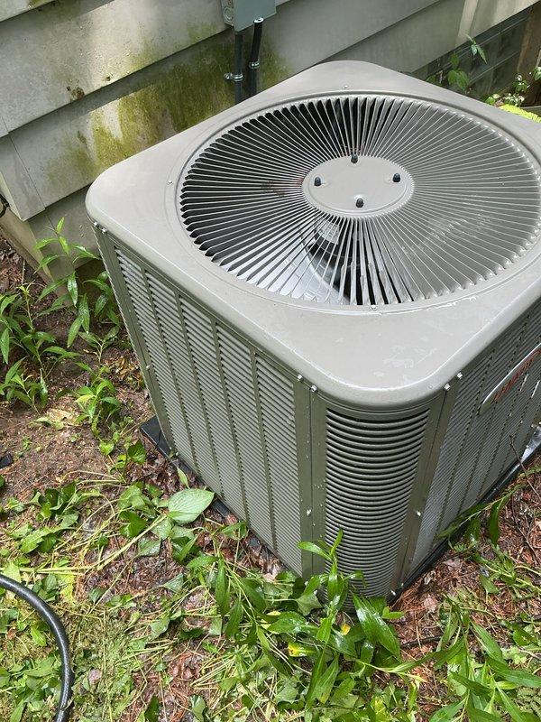 Completed routine annual maintenance on a two-year-old central air conditioning system. Upon inspection, discovered significant dirt and debris accumulation on the outdoor condenser coil, which was restricting airflow and reducing system efficiency. Thoroughly cleaned the condenser coil to remove heavy buildup of dust, grass clippings, and organic material. Inspected condenser fan operation and verified proper function. Cleared vegetation and debris from around the base of the unit to ensure adequate clearance for airflow. System tested and operating within normal parameters following maintenance.