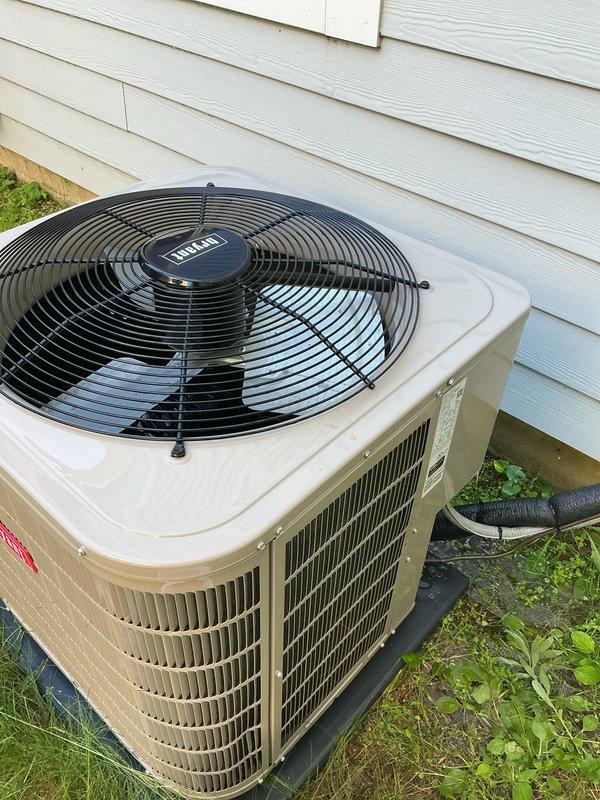 Completed scheduled air conditioning tune-up on 2022 Bryant condensing unit. Performed comprehensive maintenance inspection including checking refrigerant levels, cleaning condenser coils, testing electrical connections, verifying proper airflow through louvers and fan operation, and confirming unit operational status with no deficiencies noted.