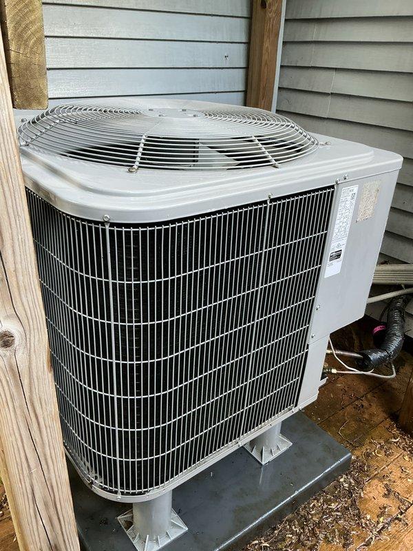 Performed comprehensive air conditioning tune-up on residential outdoor condenser unit. Completed full system inspection, verified proper operation of all components including condenser coils, fan assembly, and electrical connections. Unit found in normal operational condition with typical weathering consistent with outdoor installation.