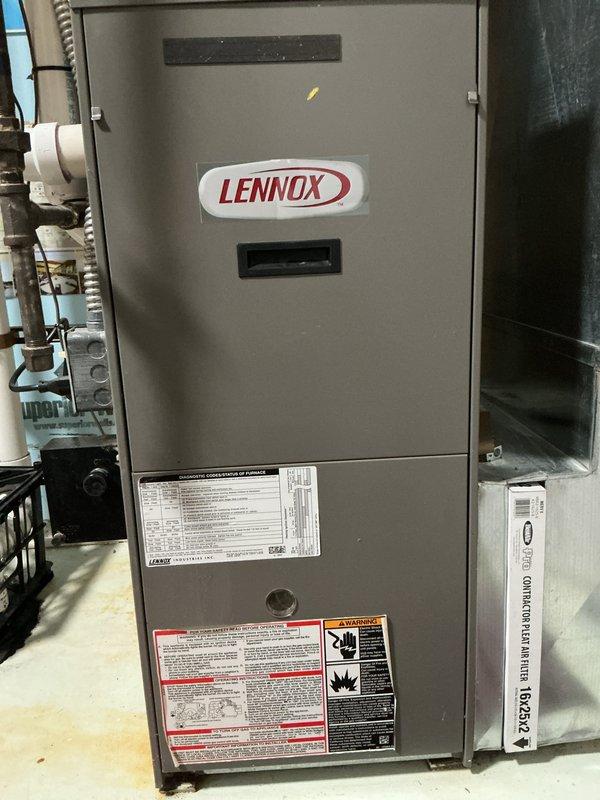 Completed residential furnace tune-up and safety inspection for city rental certification on Lennox gas furnace unit installed in basement utility area. Performed standard maintenance procedures including visual inspection of all components, verified proper operation of furnace controls and safety devices, checked condensate drain system and PVC venting configuration, inspected air filter condition, and confirmed all warning labels and manufacturer specifications were legible and intact. System found operating within normal parameters with no immediate repairs required.