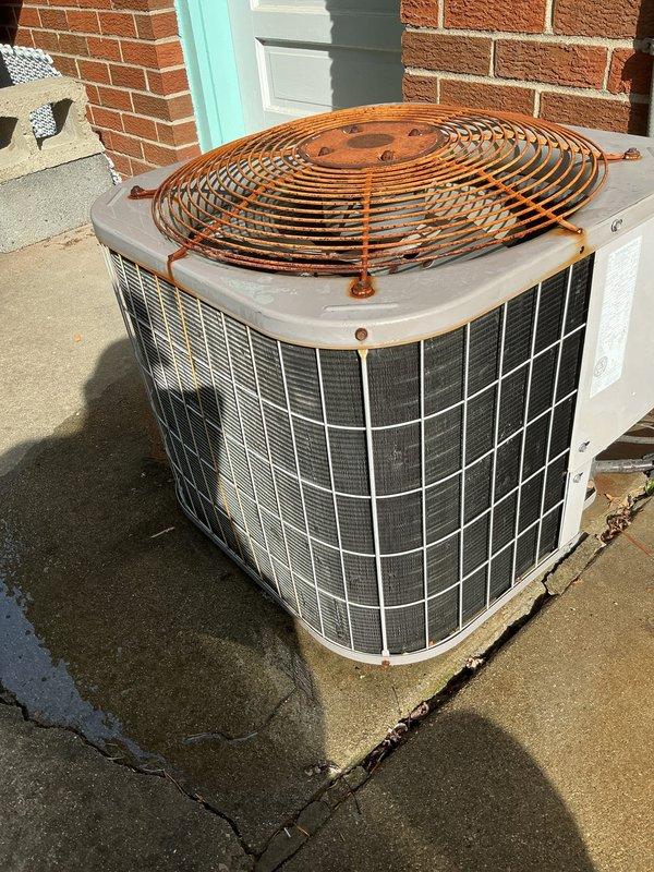 Completed annual air conditioning tune-up and preventative maintenance on outdoor condensing unit. Performed comprehensive system inspection, noting significant rust and corrosion on fan guard and motor housing requiring future monitoring. All operational components tested and verified functioning within normal parameters per manufacturer specifications.
