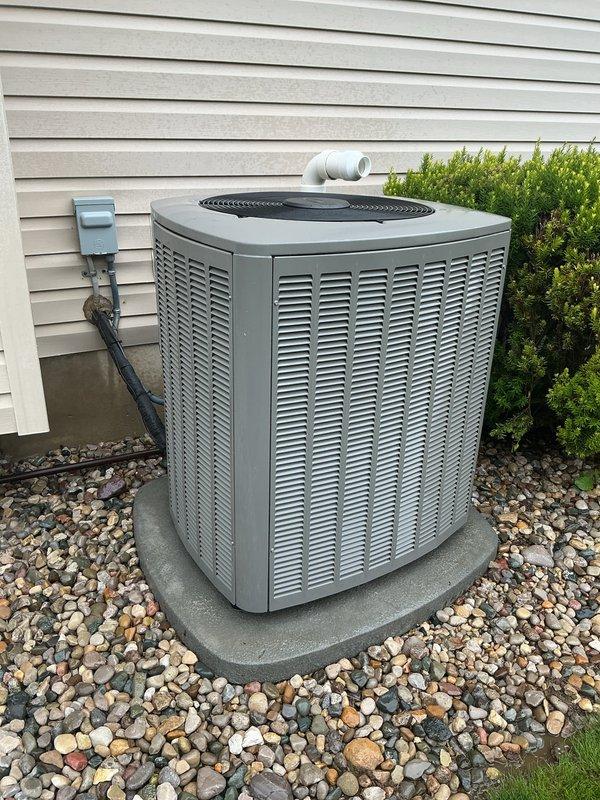 Performed comprehensive air conditioning tune-up and maintenance on outdoor condenser unit. Inspected electrical connections, disconnect box, and conduit; verified proper operation of compressor and condenser fan motor; cleaned condenser coils; checked refrigerant levels and system pressures; confirmed proper drainage through condensate line; verified unit is level on pad with adequate clearance from surrounding landscaping. System is operating within manufacturer specifications and ready for cooling season.