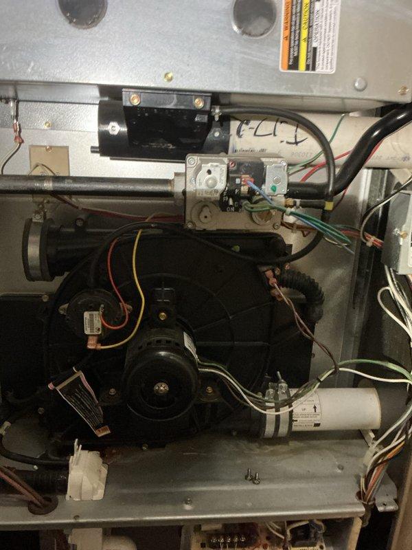 Completed comprehensive tune-up maintenance on older Payne multi-zone HVAC system including air conditioning and gas furnace units. Performed full system inspection, verified blower motor operation, checked electrical connections and capacitor function, inspected gas valve assembly and control modules, confirmed proper drainage system operation, and documented equipment condition with photos of internal components.