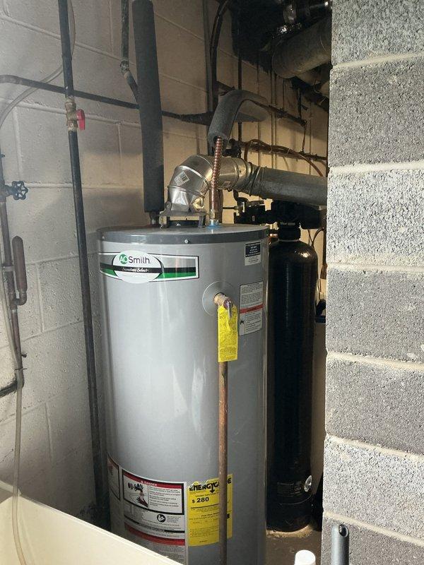 Responded to service call for 20-year-old Bryant central air conditioning system model 311AAV024070 experiencing weak airflow to multiple rooms and inability to maintain 75°F setpoint. Performed comprehensive system diagnostic including airflow measurements, static pressure testing, and visual inspection of air handler and ductwork. Evaluated blower motor operation, checked filter condition, and assessed duct system for restrictions or leakage. Documented equipment condition and mechanical room layout including water heater and related utility systems. Provided customer with findings regarding system performance limitations typical of equipment at end of expected service life and discussed options for improving comfort and efficiency.