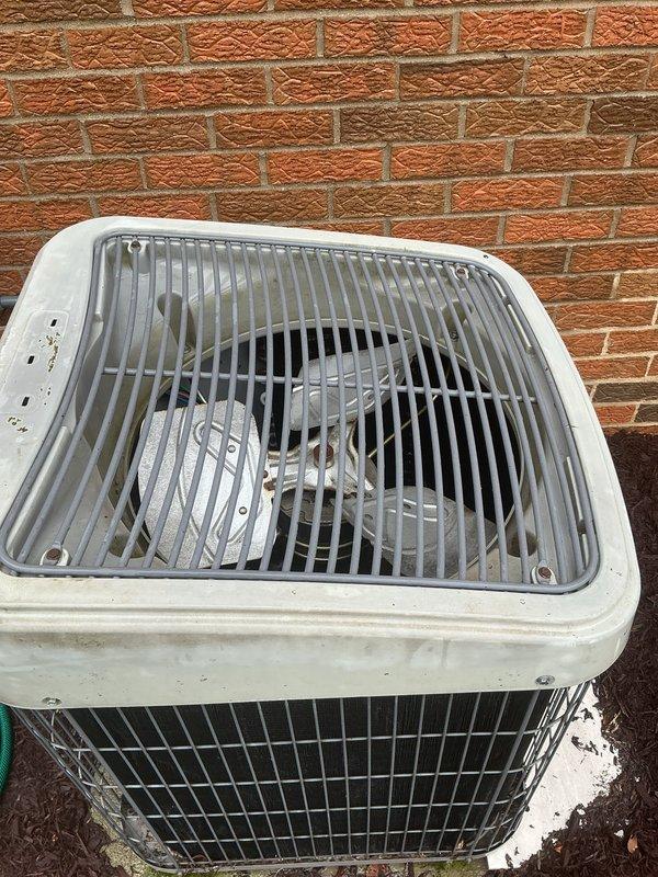 Completed seasonal air conditioning tune-up for residential customer. Upon arrival, found outdoor condenser unit with heavy accumulation of dirt, mold, and biological growth on fan blades and housing surfaces, indicating extended period without maintenance. Performed comprehensive system inspection, cleaned condenser coils and fan assembly, and verified proper operation of all components to restore unit to optimal performance.