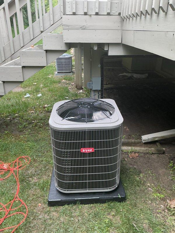 Completed full HVAC system installation including new furnace unit in basement mechanical room and Bryant brand air conditioning condenser unit on exterior pad beneath deck structure. Installed all necessary ductwork connections, refrigerant lines, condensate drainage, electrical wiring, and thermostat controls to ensure proper system operation and communication between indoor and outdoor components.