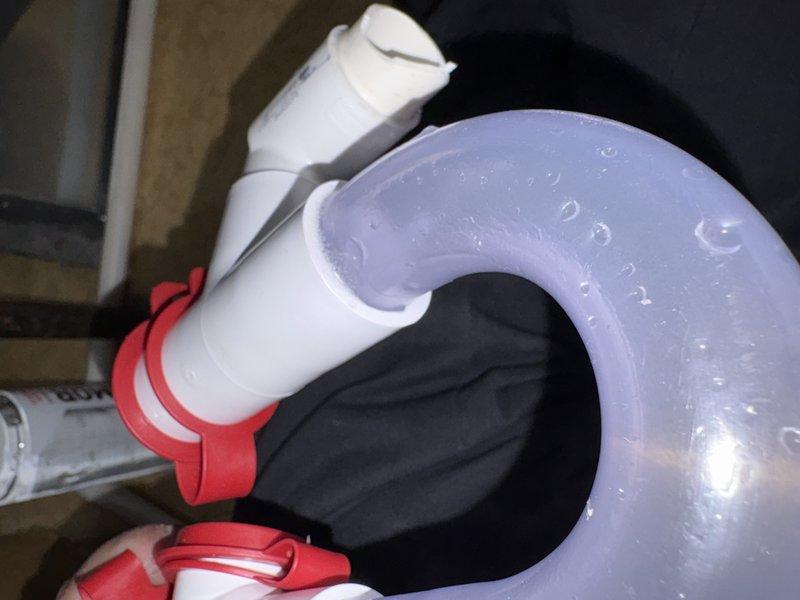 Returned to address condensate line leak that required correction following initial inspection approval. Repaired the condensate drainage assembly by replacing the defective P-trap section with a new clear flexible trap secured with proper clamps, ensuring proper water seal and leak-free operation. System tested and verified functioning correctly with no further leaks detected.