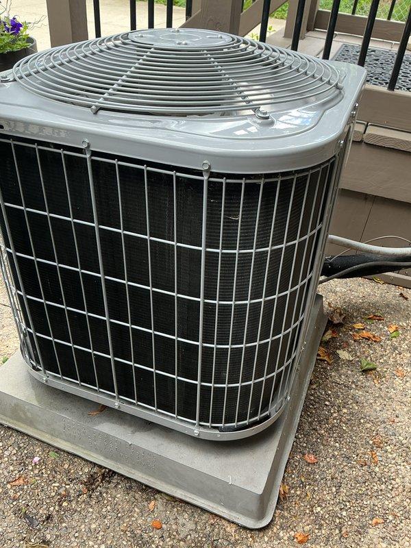 Completed annual air conditioning tune-up and preventative maintenance on residential outdoor condenser unit. Performed comprehensive system inspection, cleaned condenser coils, verified proper airflow through protective grilles, and confirmed unit operation. All components found to be in good working condition with no issues identified.