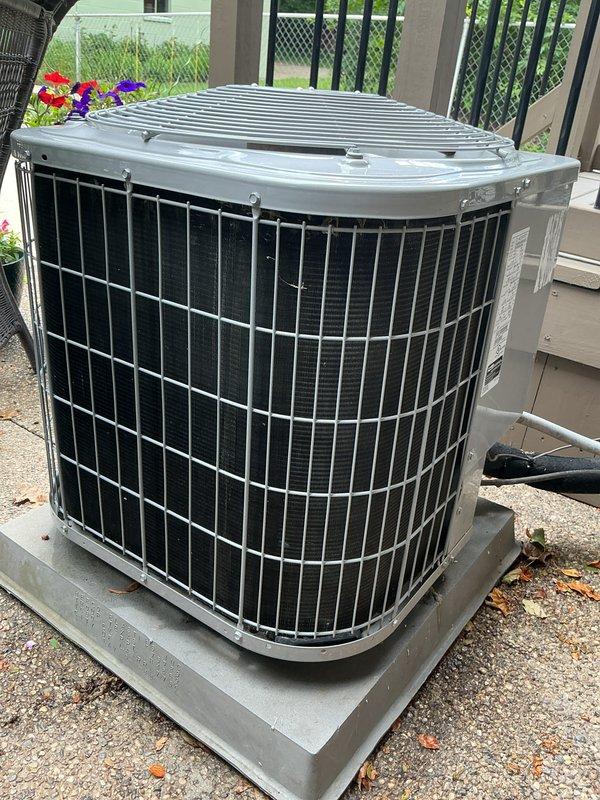 Completed annual air conditioning tune-up and preventative maintenance on residential outdoor condenser unit. Performed comprehensive system inspection, cleaned condenser coils, verified proper airflow through protective grilles, and confirmed unit operation. All components found to be in good working condition with no issues identified.
