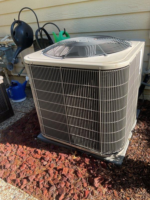 Completed scheduled preventive maintenance tune-up on 12-year-old residential air conditioning system. Performed comprehensive inspection of outdoor condenser unit, including cleaning of condenser coils, verification of refrigerant levels, testing of electrical connections and disconnect box, inspection of fan motor operation and blade condition, and assessment of unit mounting and drainage. System tested and confirmed operating within normal parameters for cooling season.