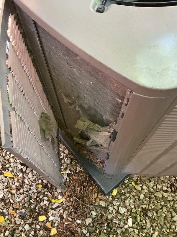 Completed comprehensive AC tune-up on 2023 residential unit as part of prepaid maintenance agreement. System operational with no major issues identified; unit shows normal weathering for outdoor installation with some debris accumulation and surface discoloration present around base and exterior panels.