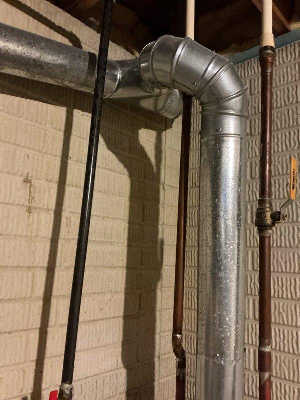 Responded to no-cooling call on older Bryant system. Found outdoor condenser fan motor inoperative while indoor air handler continued to run. Inspected outdoor unit and confirmed fan motor failure, likely due to age and wear on existing equipment. Tested capacitor and electrical connections at condensing unit. Provided system assessment and replacement options for aging HVAC system as requested. Documented equipment condition with photos of basement installation including furnace, ductwork, and associated mechanical components.