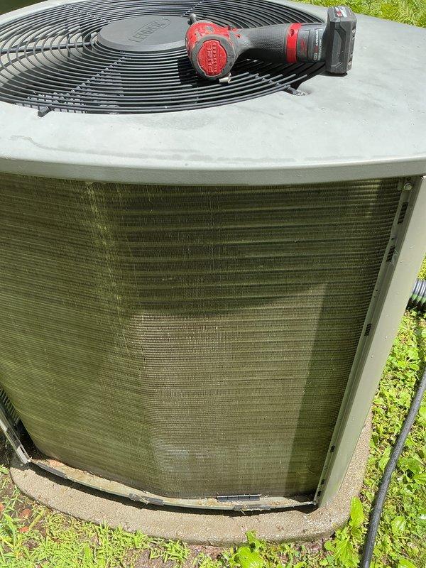 Completed AC maintenance and tune-up on outdoor condensing unit. Upon inspection, found condenser coil heavily caked with dust, debris, and mineral deposits, with significant accumulation obscuring the fins. Exterior cabinet showed extensive dirt streaking and discoloration from environmental exposure. Cleaned condenser coil, removed buildup from fins, and restored proper airflow through the unit to ensure optimal heat transfer and system efficiency.