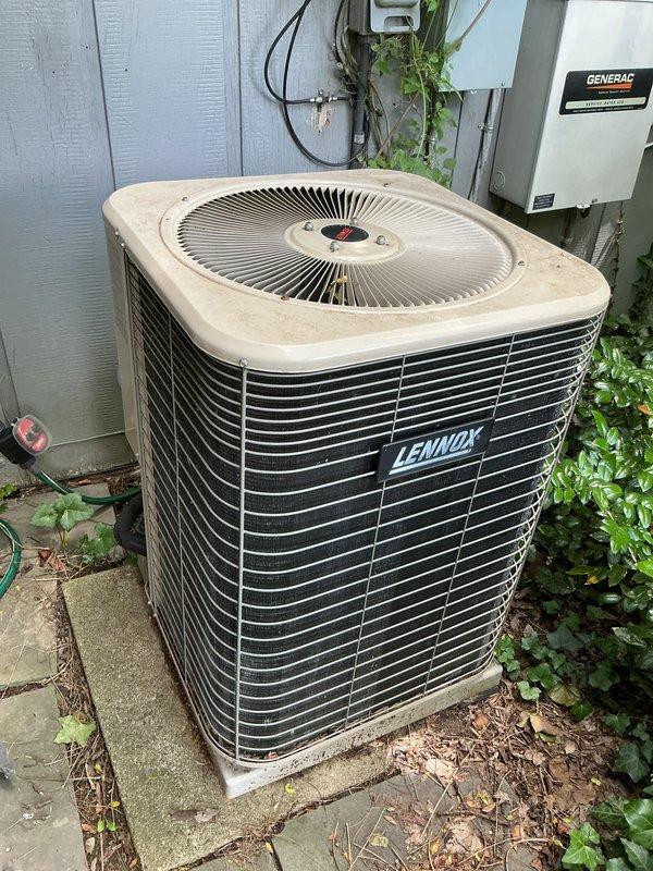 Performed comprehensive tune-up on 10-year-old Lennox air conditioning condenser unit located on exterior concrete pad. Completed full system inspection including refrigerant level check, electrical connection testing, condenser coil cleaning, fan motor operation verification, and capacitor testing. Unit operating within normal parameters with no deficiencies noted; all components functioning properly and system ready for continued service.