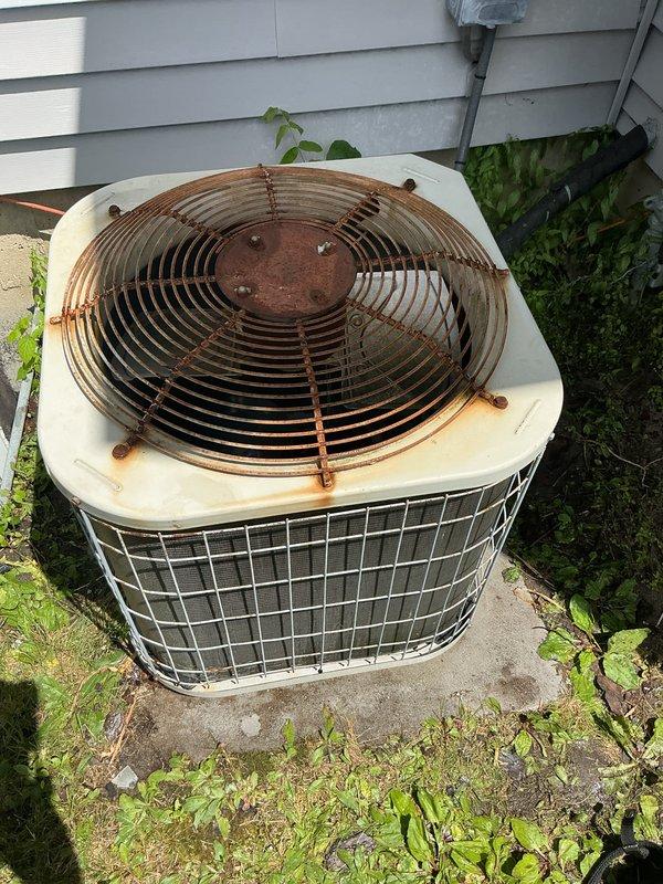Performed comprehensive preventative maintenance tune-ups on multiple HVAC systems including gas furnace, air conditioning unit, and hot water heater. Inspected outdoor condensing unit which showed significant age-related deterioration with heavy rust and corrosion on fan guard assembly, though unit remained operational. Completed all standard maintenance procedures across all equipment to ensure proper system performance during peak cooling season.
