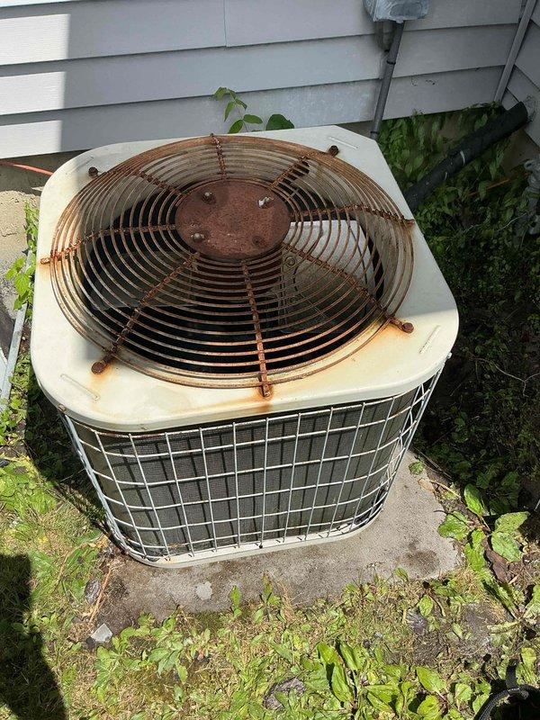 Performed comprehensive preventative maintenance tune-ups on multiple HVAC systems including gas furnace, air conditioning unit, and hot water heater. Inspected outdoor condensing unit which showed significant age-related deterioration with heavy rust and corrosion on fan guard assembly, though unit remained operational. Completed all standard maintenance procedures across all equipment to ensure proper system performance during peak cooling season.