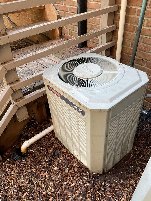 Performed comprehensive annual maintenance tune-up on Trane XE 900 outdoor condensing unit. Completed full system inspection, cleaned condenser coils, checked refrigerant levels and electrical connections, verified proper operation of all components, and documented equipment condition with photographs for service records.