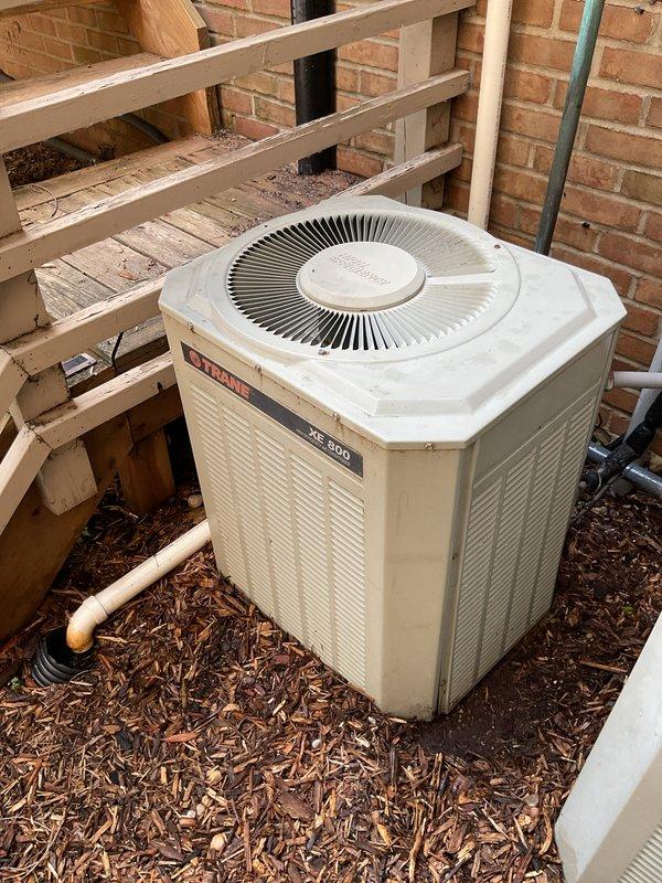 Performed comprehensive annual maintenance tune-up on Trane XE 900 outdoor condensing unit. Completed full system inspection, cleaned condenser coils, checked refrigerant levels and electrical connections, verified proper operation of all components, and documented equipment condition with photographs for service records.