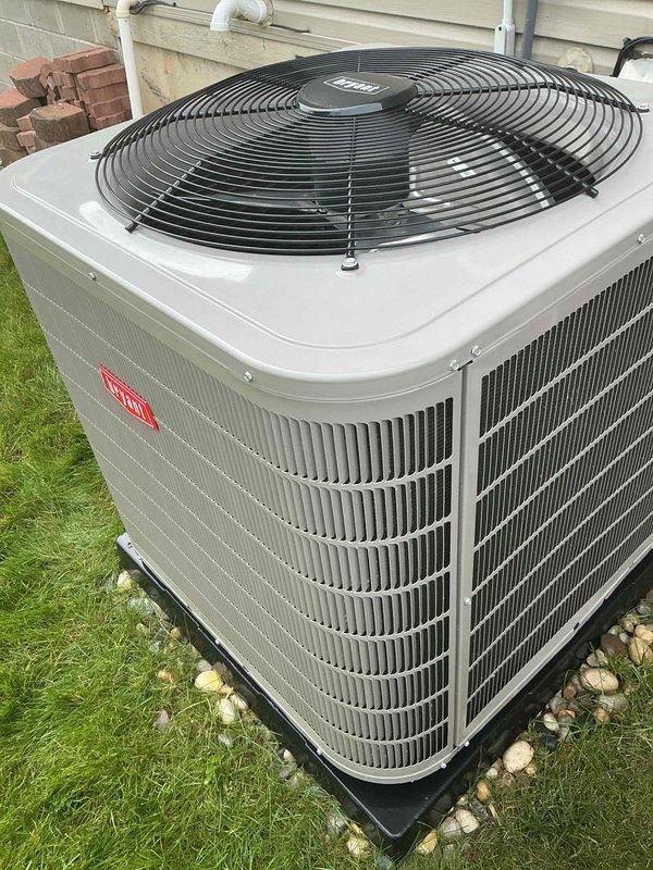 Completed installation of new Bryant outdoor air conditioning condenser unit in residential side yard. Unit was positioned on manufacturer-approved composite pad with gravel base for proper drainage and leveling. Connected refrigerant lines to indoor evaporator coil, performed vacuum and leak test, and charged system to manufacturer specifications. Verified proper electrical connections, tested fan motor operation, and confirmed unit is cycling correctly with appropriate temperature differentials.
