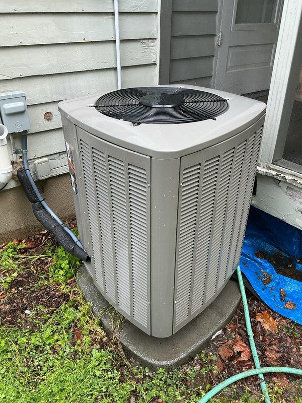 Completed scheduled heat pump tune-up on 2023 residential unit. Performed comprehensive maintenance inspection of outdoor condenser unit, which showed normal wear for age with minor dirt accumulation on exterior housing. Heat exchanger coils exhibited heavy contamination with significant buildup of dirt, dust, and environmental debris restricting airflow through fins. Cleaned condenser coils to restore proper heat transfer efficiency and system performance. Verified refrigerant lines and electrical disconnect box connections were secure. Unit operational and functioning within normal parameters upon completion of maintenance service.