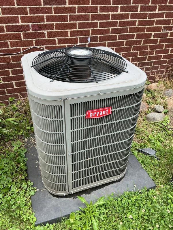 Completed scheduled air conditioning tune-up on Bryant condensing unit. Performed comprehensive system inspection, verified proper operation of all components, and documented equipment condition with photographs showing unit in good operational status with normal wear patterns consistent with outdoor exposure.