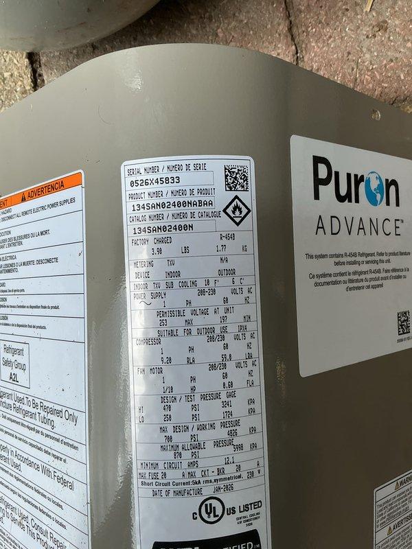 Completed full HVAC system installation including new furnace, air conditioner, and air purification system. Installed Puron ADVANCE refrigerant-based air conditioning unit with proper insulated refrigerant line routing and condensate drainage system secured with appropriate fasteners. All equipment installed to manufacturer specifications with proper labeling and UL certification verification, system tested and operational.
