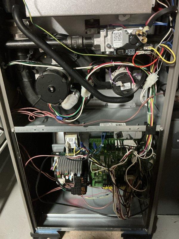 Completed comprehensive tune-up and preventive maintenance on 3-year-old residential heating and cooling system. Performed full inspection of gas furnace internal components including gas valve assembly, blower motor, pressure switches, and dual control boards with all electrical connections verified secure. Inspected heat exchanger, burner assembly, and ignition system with all components operating within manufacturer specifications. Verified proper operation of all safety controls and pressure switches. Checked and confirmed PVC venting system secure with proper drainage. Tested all electrical connections and wire harnesses for integrity. Performed air conditioning system inspection including refrigerant levels, condenser operation, and airflow verification. Changed air filter and cleaned condensate drain system. Cycled both heating and cooling systems through complete operational sequences with all functions performing normally. No deficiencies noted; system operating efficiently an
