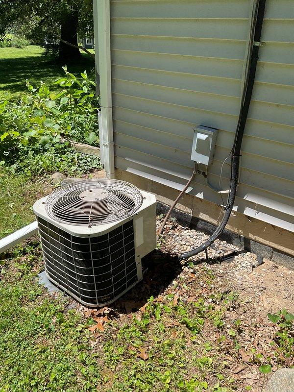 Completed scheduled AC tune-up on residential outdoor condensing unit. Performed comprehensive maintenance inspection including visual assessment of unit condition, electrical connections at disconnect box, refrigerant line set, and overall system operation. Unit found in normal operating condition with no visible damage or immediate concerns noted.