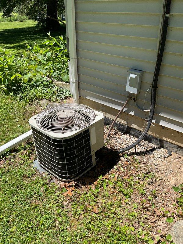Completed scheduled AC tune-up on residential outdoor condensing unit. Performed comprehensive maintenance inspection including visual assessment of unit condition, electrical connections at disconnect box, refrigerant line set, and overall system operation. Unit found in normal operating condition with no visible damage or immediate concerns noted.