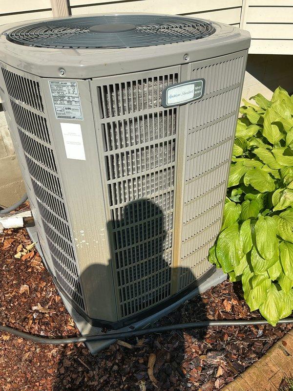 Completed routine preventive maintenance on residential American Standard air conditioning condenser unit. Performed comprehensive system inspection, verified proper operation of condenser fan assembly and compressor, checked refrigerant levels, and cleaned exterior surfaces. Unit operating within normal parameters with no deficiencies noted; system left in good working condition.