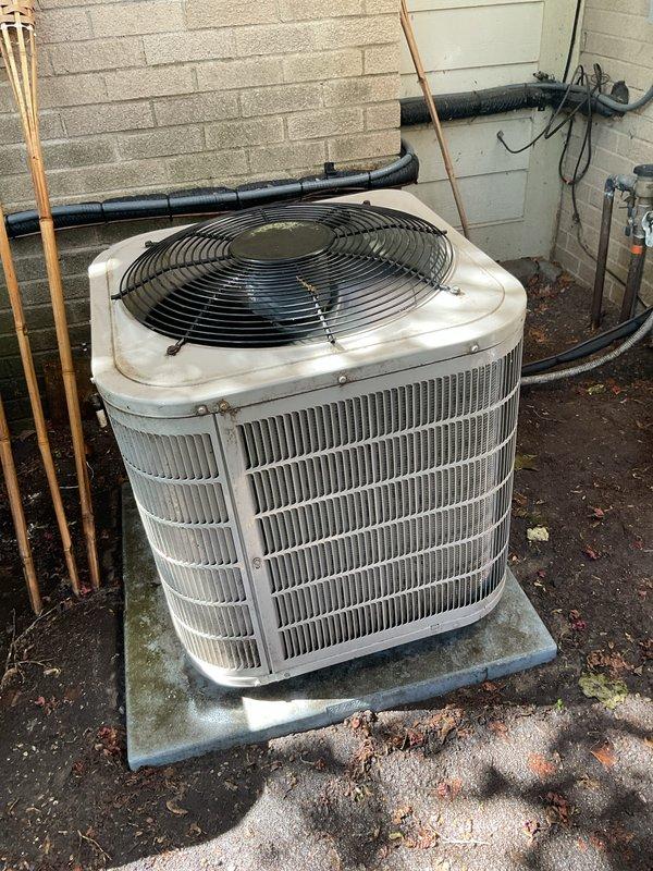 Completed membership air conditioning tune-up on outdoor condenser unit. Performed comprehensive system inspection, including examination of condenser coil fins, refrigerant lines, electrical connections, and fan operation. Unit found in serviceable condition with typical outdoor weathering; verified proper operation and collected membership renewal payment.