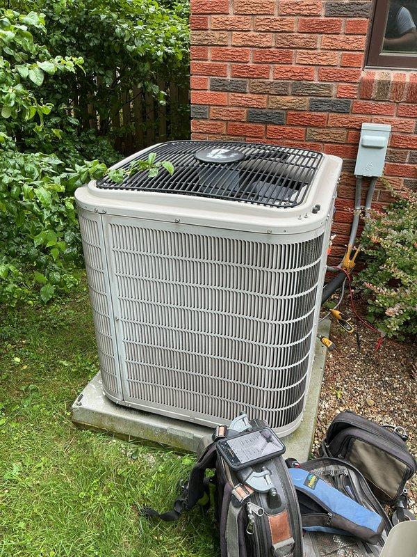 Performed comprehensive preventive maintenance and tune-up on residential air conditioning system. Inspected outdoor condenser unit, verified proper operation of cooling components, examined refrigerant lines and electrical connections, and cleaned condenser coils. Unit operating within normal parameters with no deficiencies noted at time of service.
