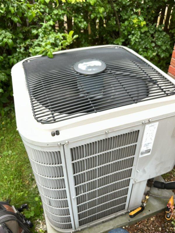 Performed comprehensive preventive maintenance and tune-up on residential air conditioning system. Inspected outdoor condenser unit, verified proper operation of cooling components, examined refrigerant lines and electrical connections, and cleaned condenser coils. Unit operating within normal parameters with no deficiencies noted at time of service.