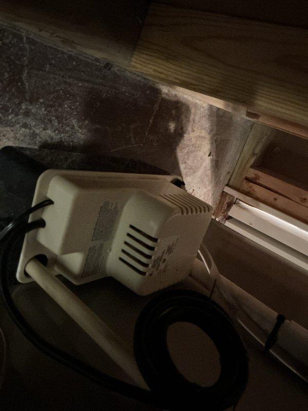 Completed full HVAC system installation including new furnace unit positioned in attic crawl space and outdoor condensing unit mounted against exterior wall. The outdoor air conditioning unit was professionally installed on concrete pad with decorative wooden screening enclosure for aesthetic integration, featuring proper clearances for airflow and serviceability. All equipment secured, connected, and tested for proper operation with system startup confirmed successful.
