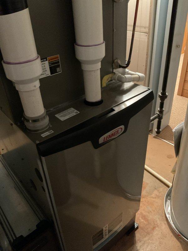 Completed comprehensive preventive maintenance on residential HVAC system including indoor gas furnace and outdoor air conditioning unit. Performed full tuneup procedures on Lennox furnace/air handler located in utility closet, inspecting combustion components, verifying proper airflow, and checking filter condition. Serviced outdoor AC condenser unit, which exhibited significant debris accumulation and clogged intake surfaces requiring attention. Cleaned condenser coils and removed heavy buildup of dirt, organic matter, and vegetation from unit exterior to restore proper airflow and system efficiency. Verified all electrical connections, refrigerant levels, and operational parameters on both systems to ensure optimal performance for upcoming cooling season.