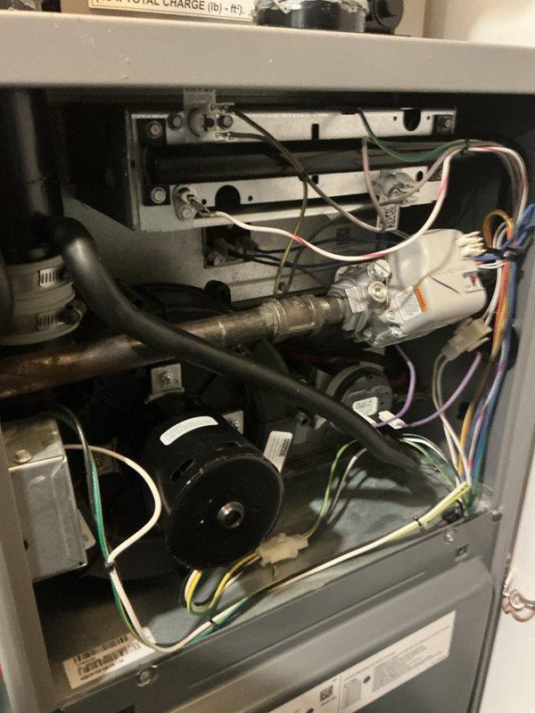 Completed comprehensive multi-system tune-up service including gas furnace, air conditioning unit, and electric water heater. Performed thorough inspection and maintenance on all three systems, documenting equipment specifications including the electric water heater (Model PROES0 T2 RH95, manufactured July 2018) with dual 4500-watt heating elements, and verified proper operation of HVAC unit internal components including blower motor assembly, electrical connections, and refrigerant system. All systems tested and confirmed operational within manufacturer specifications.