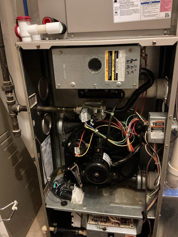 Completed comprehensive tune-up service on multi-zone HVAC system consisting of air conditioning and gas furnace units, both approximately 5-6 years old. Performed full system inspection including internal component examination, verified proper operation of blower motor assembly, checked all electrical connections and wiring harnesses, inspected gas valve and condensate drainage system with PVC piping, and conducted electrical diagnostics using digital multimeter to verify voltage and amperage readings across all major components. All systems tested within manufacturer specifications and left in proper operating condition.