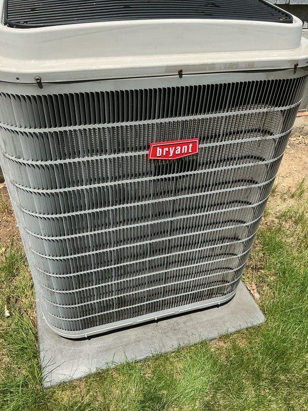 Completed scheduled air conditioning tune-up and preventative maintenance on Bryant brand outdoor condensing unit. Performed comprehensive system inspection, verified proper operation of all components, and documented equipment condition with unit showing good maintenance with clean fins, intact housing, and proper installation on level concrete pad.
