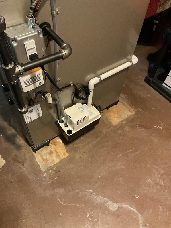 Completed full HVAC system installation in basement mechanical room, including new furnace and air conditioning unit. Installed condensate pump with PVC drainage piping routed along foundation wall, ran refrigerant lines and electrical connections to outdoor condenser unit, and ensured proper venting through existing infrastructure. All equipment tested and verified operational upon completion.
