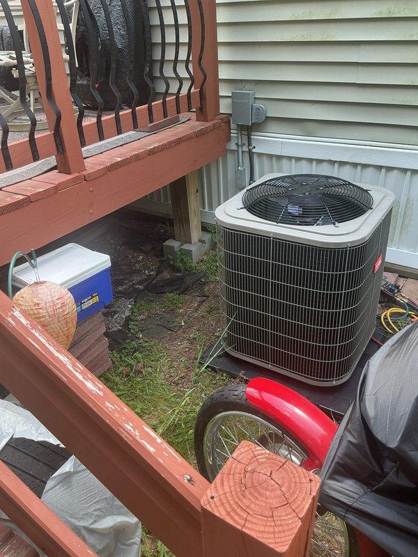 Completed installation of new air conditioning condenser unit and evaporator coil at residential property. Positioned outdoor condenser unit on ground-level pad adjacent to home exterior with proper clearance from structure, established refrigerant line connections, and verified electrical hookup to ensure system functionality. All components installed per manufacturer specifications with system tested and operational upon completion.