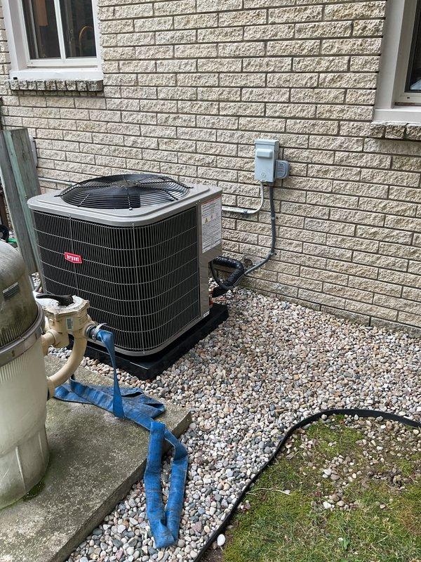 Completed full HVAC system installation including new furnace, air conditioner, humidifier, and chimney liner. Bryant outdoor condensing unit installed on gravel pad with proper electrical disconnect and refrigerant line protection. All equipment positioned per code requirements with appropriate clearances, electrical connections verified, and system tested for proper operation.