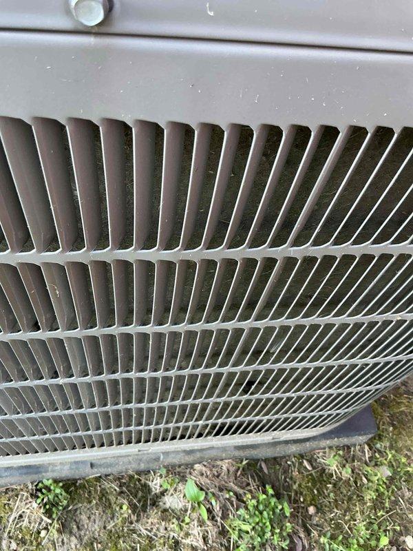 Completed preventive maintenance tune-up on 2022 residential outdoor condensing unit. Performed comprehensive inspection of condenser coil fins, protective grille assembly, and exterior casing, confirming all components in good operational condition with normal weathering consistent with outdoor exposure. Unit tested and operating within manufacturer specifications.