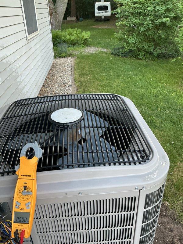 Performed routine HVAC maintenance on residential air conditioning system. Conducted diagnostic testing using Fieldpiece meter to verify system performance and operational parameters. Inspected outdoor condenser unit, confirmed proper airflow through coil fins, and verified fan motor operation and protective grille integrity.