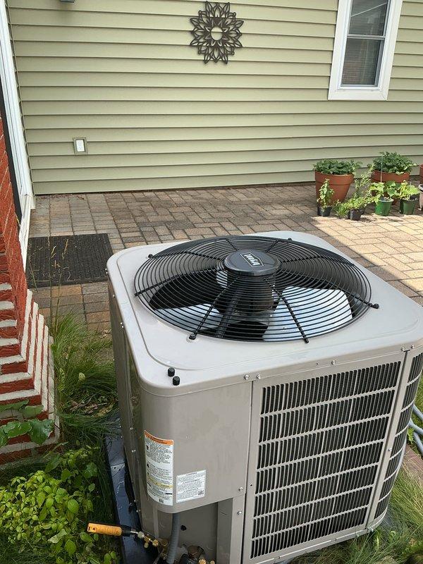 Completed annual AC maintenance on a four-year-old residential cooling system with no reported issues or symptoms. Performed comprehensive tune-up procedures on the outdoor condensing unit, including electrical performance testing with amperage readings confirming proper compressor operation at 68.9 amps. System found operating within normal parameters with all components functioning correctly.