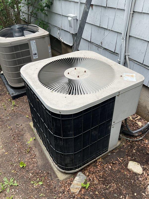 Completed comprehensive preventative maintenance tune-ups on two residential air conditioning systems: a 2021 model unit and a 1998 model unit, both located on exterior concrete pads. Performed standard inspection protocols including checking refrigerant levels, cleaning condenser coils, inspecting electrical connections, testing capacitors, verifying proper airflow through louvered panels, and ensuring both systems operate within manufacturer specifications for optimal cooling performance.