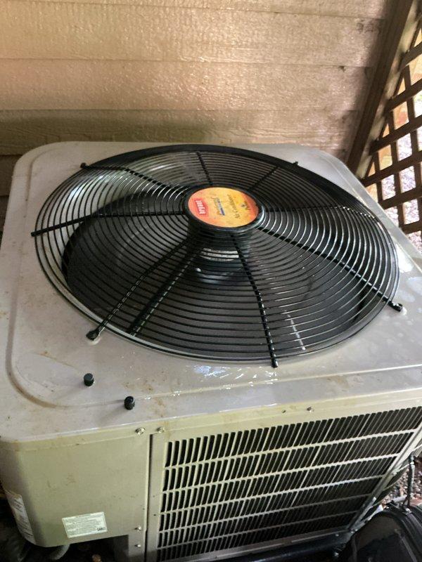 Completed comprehensive AC tune-up on outdoor condensing unit as part of prepaid maintenance agreement. Performed standard preventive maintenance procedures including inspection of condenser coils, fan assembly, and electrical components. Unit showed normal weathering consistent with outdoor installation beneath deck structure, with all components operating within manufacturer specifications at time of service.