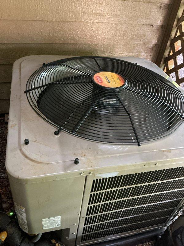 Completed comprehensive AC tune-up on outdoor condensing unit as part of prepaid maintenance agreement. Performed standard preventive maintenance procedures including inspection of condenser coils, fan assembly, and electrical components. Unit showed normal weathering consistent with outdoor installation beneath deck structure, with all components operating within manufacturer specifications at time of service.