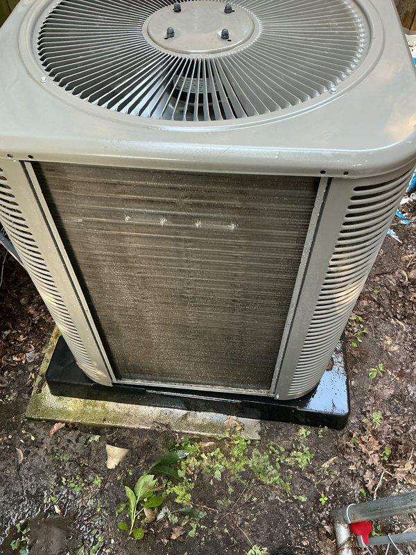 Completed annual air conditioning tune-up on outdoor condensing unit. Inspected condenser coils, which showed moderate dirt accumulation and discoloration, and cleaned exterior surfaces. Unit is approximately two years old and operating within normal parameters.