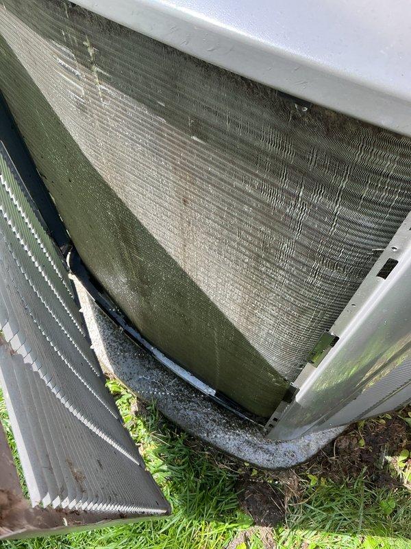 Responded to no-cooling call on 2022 installation displaying error code 31. Upon inspection, discovered severely contaminated condenser coils with heavy algae, mold, and organic debris buildup restricting airflow, along with a heavily clogged air filter saturated with dust and lint accumulation. Performed thorough coil cleaning to remove biological growth and debris from condenser fins, replaced dirty air filter, and cleared system obstructions. Cycled unit through complete operational test, confirmed error code cleared, verified proper cooling function restored, and system returned to normal operation under full warranty coverage.